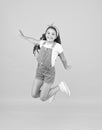 Jump of happiness. small girl jump yellow background. full of energy. Active girl feel freedom. Fun and relax. feeling