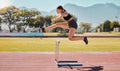 Jump hurdle, athlete and woman in competition, on track or running to win, for wellness and healthy. Fitness, female and