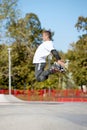 Jump. One man, male roller skater on rollerblades training at modern skate park, outdoors. Action, motion, skills and