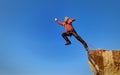 Jump rope from a high rock in the mountains Royalty Free Stock Photo
