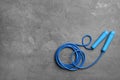 Jump rope and space for text on grey background Royalty Free Stock Photo