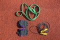 Jump rope, sports gloves and a tourniquet for sports training Royalty Free Stock Photo