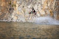 Jump, wakeboard and extreme sports with man in lake for action, summer break and travel vacation. Wave, adrenaline Royalty Free Stock Photo