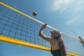 Jumping beach volleyball female player . woman reaches for the ball. throwing a yellow volleyball over the net. Victory Royalty Free Stock Photo