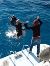 Jumping into the blue water Royalty Free Stock Photo