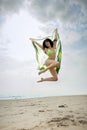 Jumping with Brazil flag on beach Royalty Free Stock Photo