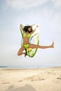 Jumping with Brazil flag on beach Royalty Free Stock Photo