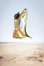 Jumping with Brazil flag on beach Royalty Free Stock Photo