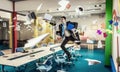 Jumping businessman in office . Mixed media Royalty Free Stock Photo