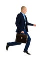 Jumping Businessman in suit with briefcase, isolated on white background, full length portrait. Royalty Free Stock Photo