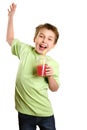 Jumping child holding healthy fruit juice Royalty Free Stock Photo