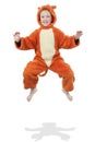 Jumping child in tiger disguise