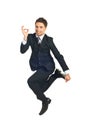 Jumping executive showing okay sign Royalty Free Stock Photo