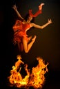 Jumping through fire Royalty Free Stock Photo