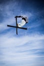 Jumping freestyle skier on blue sky background. Royalty Free Stock Photo