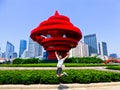 Jumping in front of May Wind sculpture