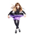 Jumping girl in bat costume Royalty Free Stock Photo