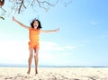 Jumping girl in the beach Royalty Free Stock Photo