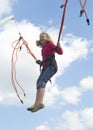 Jumping girl (blue sky) Royalty Free Stock Photo