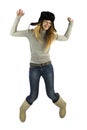 Jumping girl in earflapped hat Royalty Free Stock Photo