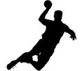 Jumping handball player with ball in hand. Silhouette Royalty Free Stock Photo