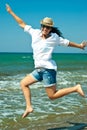 Jumping happy woman on the beach Royalty Free Stock Photo