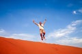 Jumping high on the sand dunes Royalty Free Stock Photo