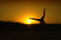 Jumping for joy in the sunset Royalty Free Stock Photo