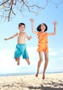 Jumping kids in the beach Royalty Free Stock Photo
