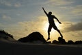 Jumping Man Reaching for the Stars at Sunrise Royalty Free Stock Photo