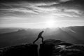 Jumping man. Young man makes step between cliffs.