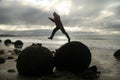 Jumping over boulders Royalty Free Stock Photo