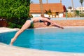 Jumping into the pool Royalty Free Stock Photo