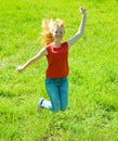 Jumping red-haired teen girl