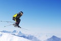 Jumping skier at mountains