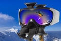 Jumping Skier in the Mountain in ski goggles