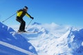 Jumping skier at mountains