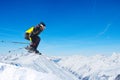 Jumping skier at mountains