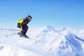 Jumping skier at mountains