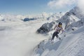 A jumping snowboarder in the mountains. Snowboarding, winter extreme sport. Royalty Free Stock Photo