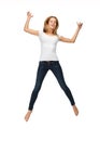 Jumping teenage girl in blank white t-shirt Royalty Free Stock Photo