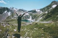 Jumping Traveler Man raised hands mountains Travel Lifestyle emotional concept adventure summer vacations outdoor hiking Royalty Free Stock Photo