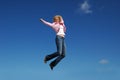 Jumping woman on a sunny day Royalty Free Stock Photo