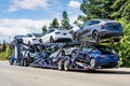 Jun 6, 2020 / CA / USA - Car transporter carries new Tesla Model Y on the upper level and Tesla Model 3 on the lower level