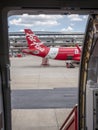 28 jun 20, Donmueng Airport, Bangkok, Thailand. Airasia, low cost airline, Aircraft servicing during transit. view from another ai