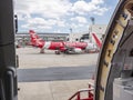 28 jun 20, Donmueng Airport, Bangkok, Thailand. Airasia, low cost airline, Aircraft servicing during transit. view from another ai