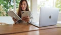 Jun 16th 2020 : A woman holding and using Iphone 11 Pro Max smart phone and Apple New Ipad Pro 2020 tablet pc with Apple
