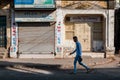 A man walks through a deserted market