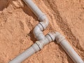 Junction of plastic sewer pipes. Sewage pipeline system of residential building under construction Royalty Free Stock Photo