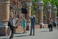 June 7, 2015 St. Petersburg, Russia. A street photographer with an assistant takes pictures of a couple in love